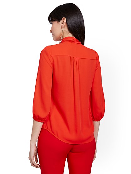 54.95 T PIPED BOW BLOUSE