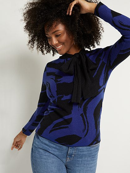 49.95 PRINT BOW SWEATER