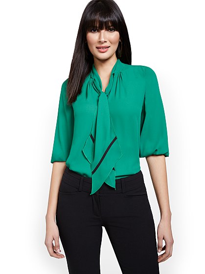 54.95 T PIPED BOW BLOUSE